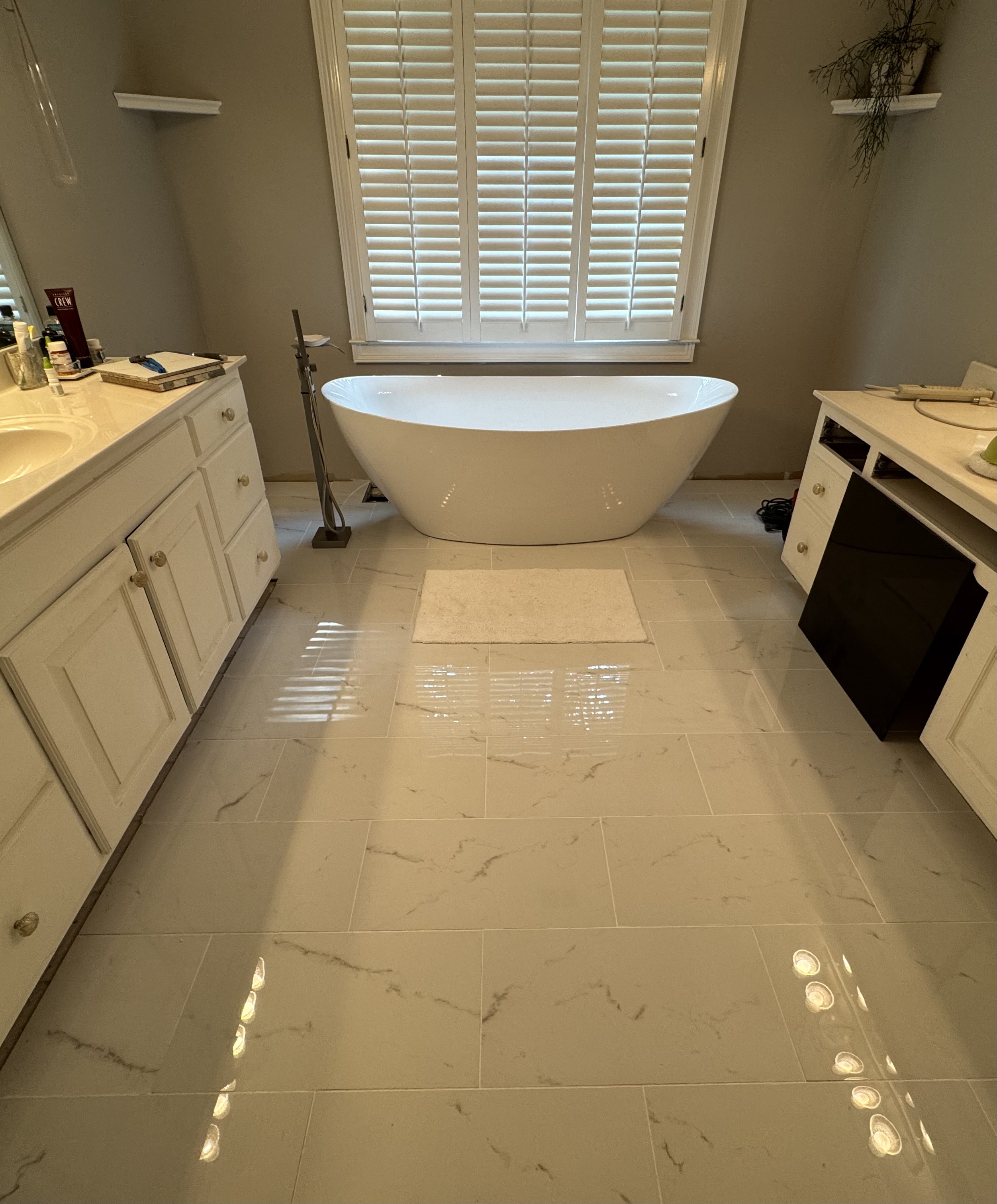 Bathroom remodel – frameless glass shower with large-format tile